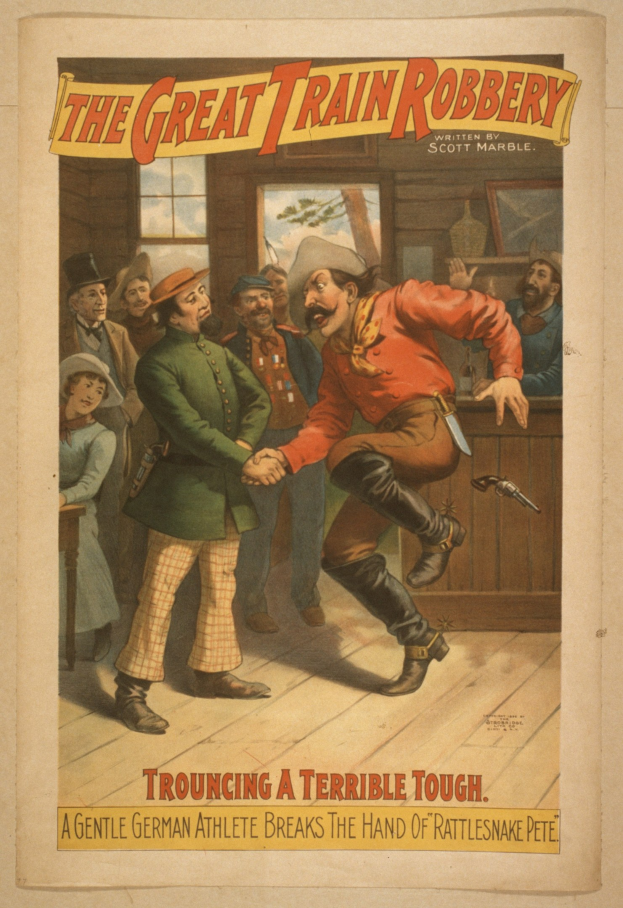 Plakat, das eine Gruppe von Menschen auf einem Boden zeigt, wobei einer eine Waffe hält, ein Fenster und eine Wand im Hintergrund und den Text "The Great Train Robbery - Tough a Terrible Tough" oben und unten.