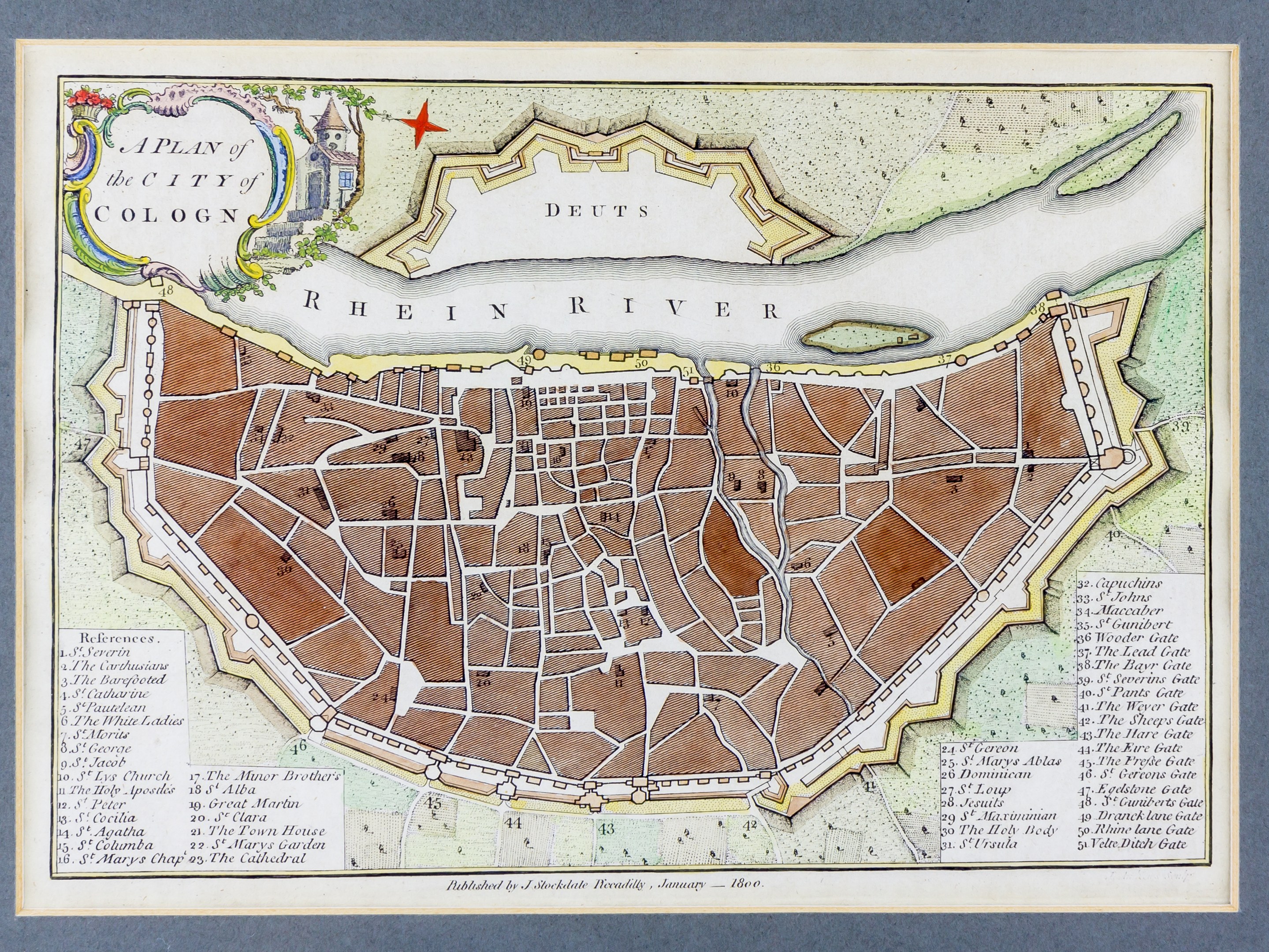 Ein gerahmtes Bild einer Karte von Köln, Deutschland, mit dem Rhein im Hintergrund.