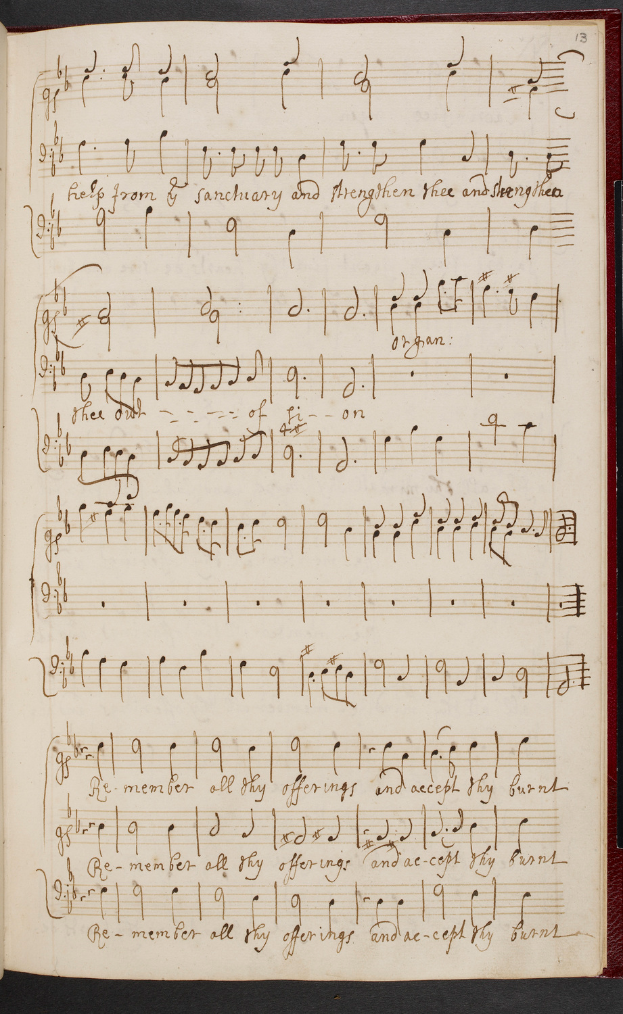 Ein aufgeschlagenes Buch mit Noten und Text, das eine Sammlung von Musik darzustellen scheint.